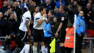 Ledley King, left, and Gareth Bale of Tottenham Hotspur appeal to the assistant referee after Juan Mata of Chelsea scored, but to no avail.