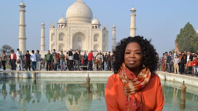 US talk show host Oprah Winfrey poses in front of the Taj Mahal on January 19, 2012. AFP