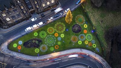 Geometric neon snowflakes created by artist Hannah Ayre were pictured from above on Wednesday in Edinburgh. The artworks surround the city's Christmas Tree on The Mound. PA