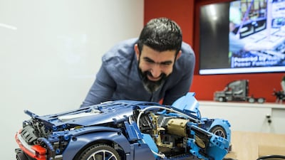A visitor looking at Lego toy car. Leslie Pableo for The National