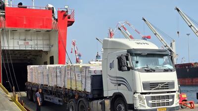 A ship is loaded before carrying 2,500 tonnes of UAE aid to Gaza. Wam