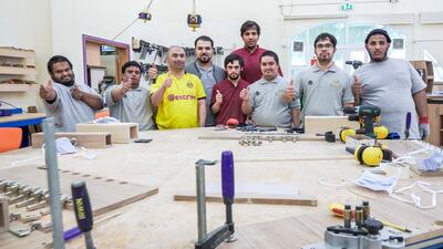 The team of carpenters get to work on their latest project, making tables and podiums used in mosques and government buildings