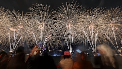 Crowds gather on the Corniche in Abu Dhabi. Victor Besa / The National