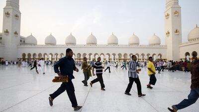 Muslims observe Eid al Fitr prayers at the Sheikh Zayed Grand Mosque in Abu Dhabi. Christopher Pike / The National