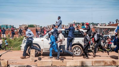 Musician turned politician Robert Kyagulanyi, also known as Bobi Wine, greets supporters as he makes his way to be officially nominated as presidential candidate, in Kampala, Uganda. AFP