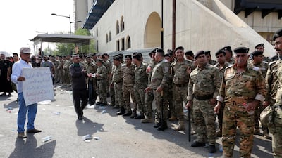 Iraqi policemen during the demonstration. EPA