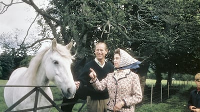Queen Elizabeth and Prince Philip visit a farm on the Balmoral estate in Scotland, during their Silver Wedding anniversary year, in 1972. Getty Images