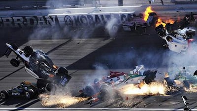 The car of Dan Wheldon, second left, is thrown into the air following an horrific crash at the Las Vegas Indy 300. The English driver died as a result of his injuries.