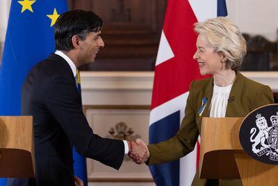 Britain's Prime Minister Rishi Sunak and EU Commission President Ursula von der Leyen shake hands in Windsor, England on Monday after striking a deal to reform the Northern Ireland Protocol. AP