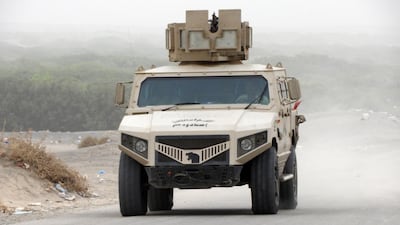 An armoured vehicle travels through Al Durayhimi district, about nine kilometres south of Hodeidah international airport, as Yemeni pro-government forces backed by the Saudi-led coalition launched an offensive to retake the rebel-held Red Sea port city of Hodeidah on June 13, 2018. Nabil Hassan / AFP