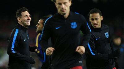 Lionel Messi of Barcelona and teammate Neymar warm up before their Champions League contest on Tuesday against AS Roma at the Camp Nou. Pau Barrena / AFP