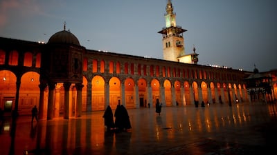 Muslim women walk in the courtyard of the 7th century Umayyad Mosque in Damascus, Syria, Wednesday, October 3, 2018. AP