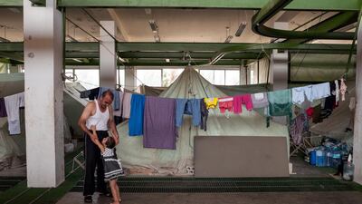 110 Syrian refugees live in tents erected inside an abandoned slaughterhouse. The 16 families live communally, sharing food, water, chores, childcare and often even money as they struggle to support themselves on aid rations, food vouchers and the generosity of the host community. They have no access to medical care or prescription drugs and there is little hope for gainful employment in the region, which already suffered from underemployment even before the influx of Syrian refugees.