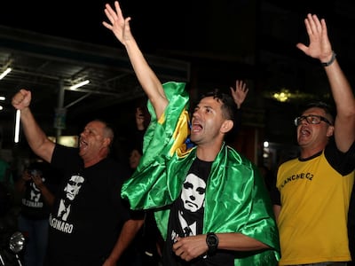 Protestors shout slogans in support of presidential candidate Jair Bolsonaro in Aparecida do Norte, Brazil September 20, 2018. Reuters