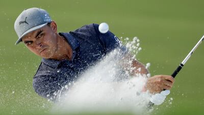 Rickie Fowler hits from the bunker on the 16th hole during the first round of the PGA Championship. Chris O'Meara / AP Photo