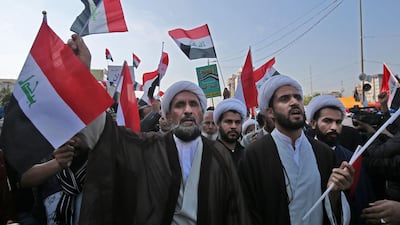 Iraqi Shiite Muslim clerics and supporters of the Hashed Al Shaabi armed network, demonstrate in the capital Baghdad's Tahrir Square. Several thousand Iraqis backing the paramilitary force close to Iran flooded the Iraqi capital's main protest camp today, worrying anti-government demonstrators who have denounced Tehran's role in their country. AFP