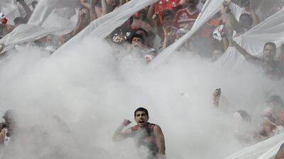 Fans of River Plate cheer their for team before a local tournament match against Boca Juniors in Buenos Aires, Argentina. Natacha Pisarenko / AP Photo