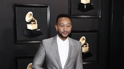 John Legend wears an asymmetric suit jacket by Alexander McQueen for the 62nd Annual Grammy Awards. EPA