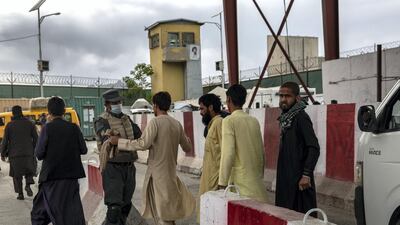 Police officers check cars and arrivals coming into the Afghan capital at the Kabul-Jalalabad highway gate. Stefanie Glinski for The National