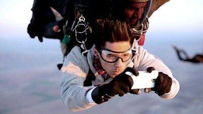 HTC challenged Nick Jojola, above, who had never skydived before, to take pictures using HTC One handsets while freefalling at more than 200kph. Courtesy HTC