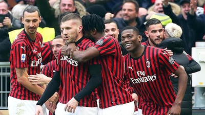 Ante Rebic (C-L) celebrates with teammates after scoring the winning goal for AC Milan against Udinese. EPA