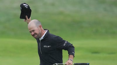 Brian Harman of the US celebrates on the 18th green after winning the Open Championship by six shots at the Royal Liverpool Golf Club in Hoylake, England, Sunday, July 23, 2023. AP