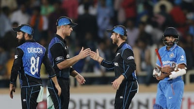 New Zealand's James Neesham, second left, and Kane Williamson celebrate their team's victory over India in the fourth one-day international cricket match in Ranchi, India, Wednesday, October 26, 2016. Rajanish Kakade / AP Photo