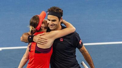 Roger Federer and Belinda Bencic of Switzerland celebrate after beating the USA 4-2, 4-3 in the mixed doubles match. EPA