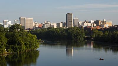 Downtown Richmond, with James River pictured in the foreground. The city is steeped in American Civil War history. Corbis / Phocal Media