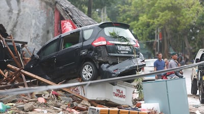 A damaged car is seen among the debris in Pandeglang. EPA