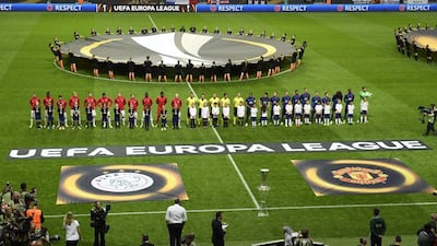 The Ajax and Manchester United teams line-up ahead of kick-off. Pontus Lundahl / EPA