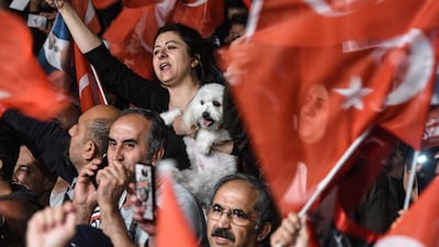 Supporters of Mayor Ekrem Imamoglu cheer as they protest against a decision to re-run the Istanbul election. Getty