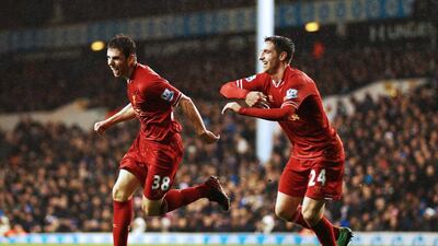 Jon Flanagan, left, is giving Liverpool fans plenty of reasons to get on their feet and cheer. Paul Gilham / Getty Images