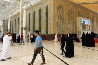Tourists stroll at a holy site in the Iraqi city of Najaf. AFP