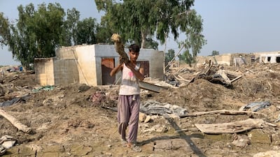 Mr Jan saves what he can from his house.