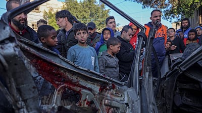 A car that was destroyed in an Israeli attack on Rafah, southern Gaza. Cairo talks suggest Hamas is modifying its negotiating position. AFP