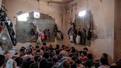 Suspected ISIS members in a prison south of Mosul in July 2017. AP Photo