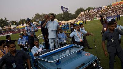 Pele blows a kiss at the spectators as he is taken around the stadium in an open jeep while attending the Subroto Cup on Friday. Saurabh Das / AP