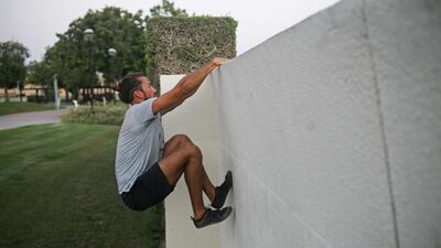 Paul, a student, practices climbing the wall. Lee Hoagland/ The National