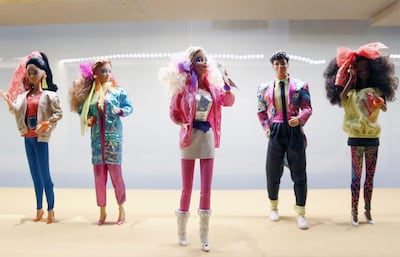 Barbie dolls on display at an exhibition called Barbie, Life of an Icon, in Paris. Getty Images