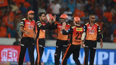Rashid Khan, left, will take on Sunrisers Hyderabad teammate Kane Williamson, right, when Afghanistan lock horns with New Zealand. Mahesh Kumar A / AP Photo