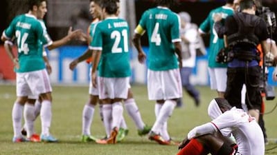 Mexico, in green, edged past Trinidad 1-0 in the quarter-finals of the Gold Cup.