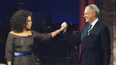 Oprah Winfrey appears with David Letterman during a taping of The Late Show with David Letterman, in New York. Following the interview, Dave escorted Oprah across 53rd street to the opening of her new Broadway Show The Color Purple. AP