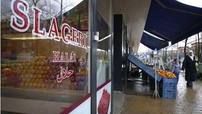 A halal butcher's shop in Amsterdam. The Dutch parliament may soon pass a law banning Jewish and Muslim traditions on the ritual slaughter of cows, sheep and chickens. Peter Dejong / AP Photo
