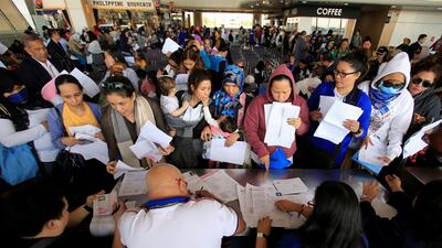 Around 190 Overseas Filipino Workers from Kuwait submit their documents upon their arrival at the Ninoy Aquino International Airport in 2018. Reuters