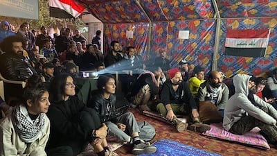 People attend a screening at the Cinema of the Revolution tent in Tahrir Square, Baghdad, Iraq. Photo courtesy of Mohanad Hayal