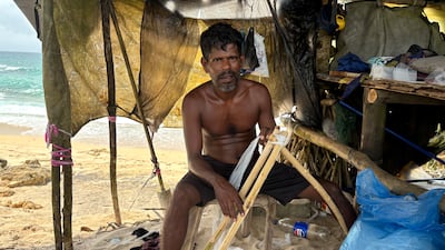 Rasika Welheelae, 45, makes stilts for fishing using kithul wood