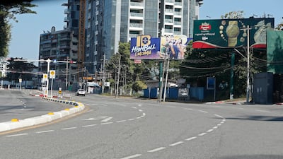 A taxi travels along an empty street in downtown Yangon. The military overthrew leader Aung San Suu Kyi and her government on February 1, triggering protests. EPA