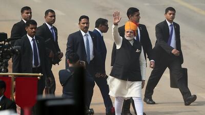 Prime Minister Narendra Modi waves to spectators after the end of Republic Day parade in New Delhi. Money Sharma / AFP