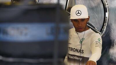 Lewis Hamilton gestures in his team garage on Friday during the practice sessions for the British Grand Prix. Phil Noble / Reuters / July 4, 2014